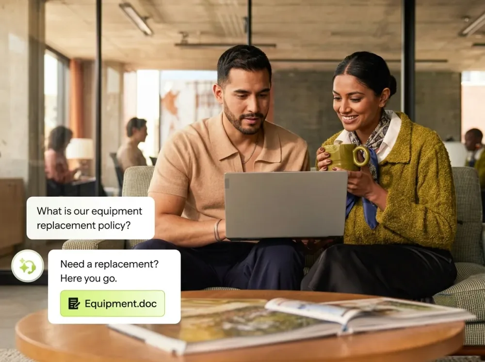 Two colleagues at a laptop while an AI agent answers a question about the equipment policy